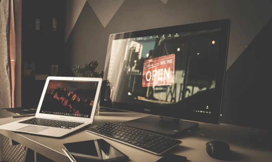 A larger computer screen, laptop, tablet, and smartphone