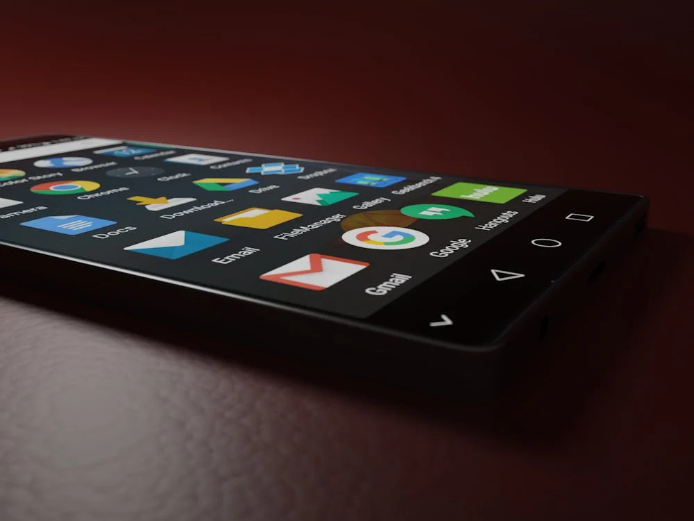 A black smartphone with apps pulled up