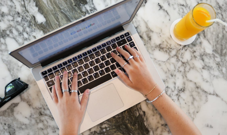 A person typing on a laptop