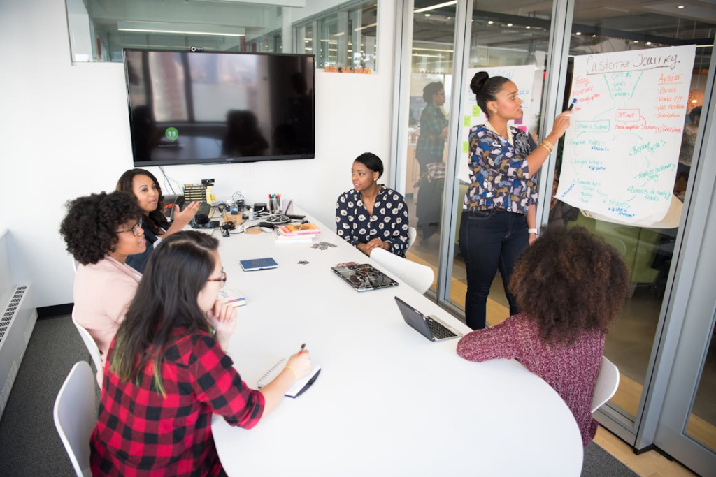 A group of women attending a training session in the office