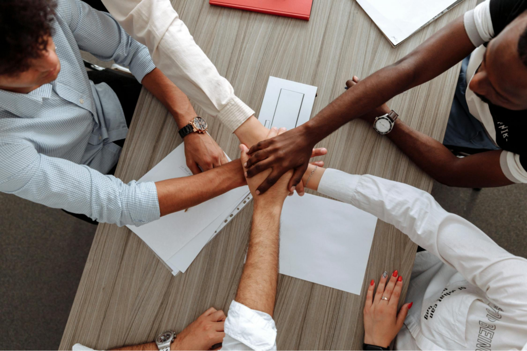 People stacking hands to celebrate a job well done